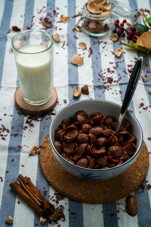 a bowl of cereal next to a glass of milk, inspired by Ödön Márffy, dark brown, brown:-2, lifestyle, gif