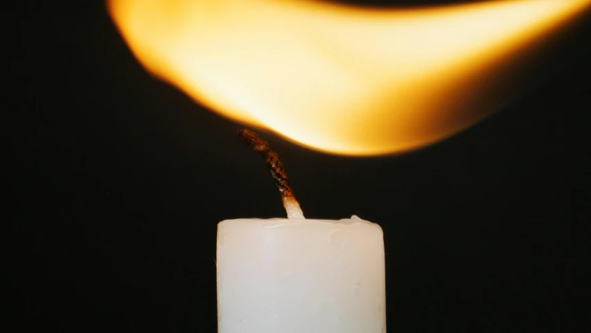 a lit candle with a flame coming out of it, inspired by Elsa Bleda, trending on pexels, in style of robert mapplethorpe, hot glue, instagram photo, scientific photo