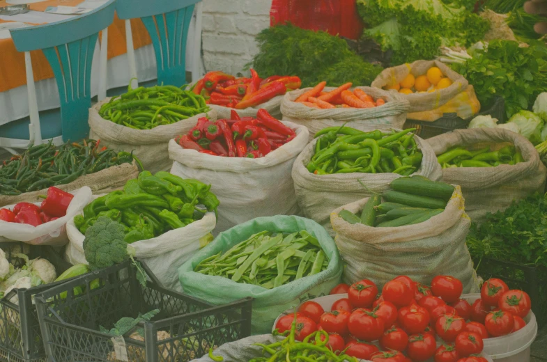 a market filled with lots of different types of vegetables, profile image, green blue red colors, header, linen