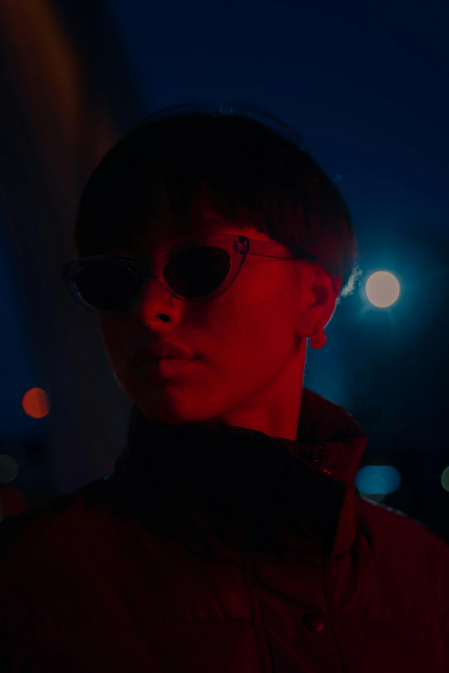 a close up of a person wearing a hat and sunglasses, inspired by Liam Wong, cinematic red lighting, slick hair, ( ( theatrical ) ), shin jeongho