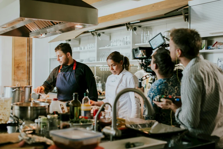 a group of people in a kitchen preparing food, on location, profile image, fan favorite, tv production