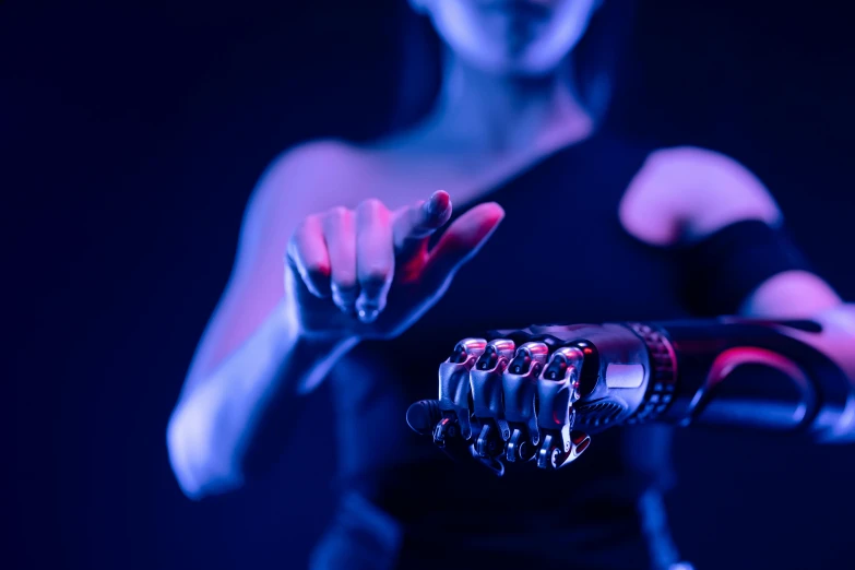 a close up of a person holding a robotic hand, cyberpunk art, unsplash, neo-figurative, cyberpunk strip clubs, biblical female android, hyperealistic octane render, with a blue background