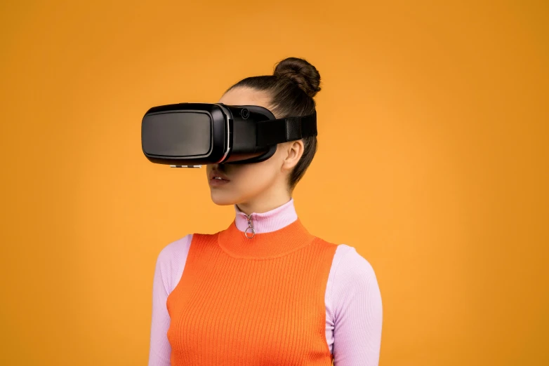 a woman wearing a virtual reality headset, by Adam Marczyński, trending on pexels, hypermodernism, in front of an orange background, cyber school girl, wide high angle view, 🦩🪐🐞👩🏻🦳