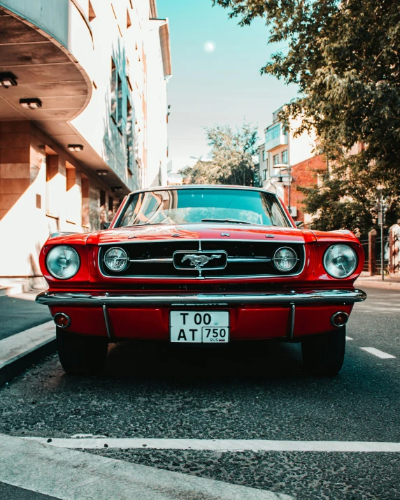 a red car parked on the side of the road, pexels contest winner, mustang, old fashion, 🚿🗝📝, wide screenshot