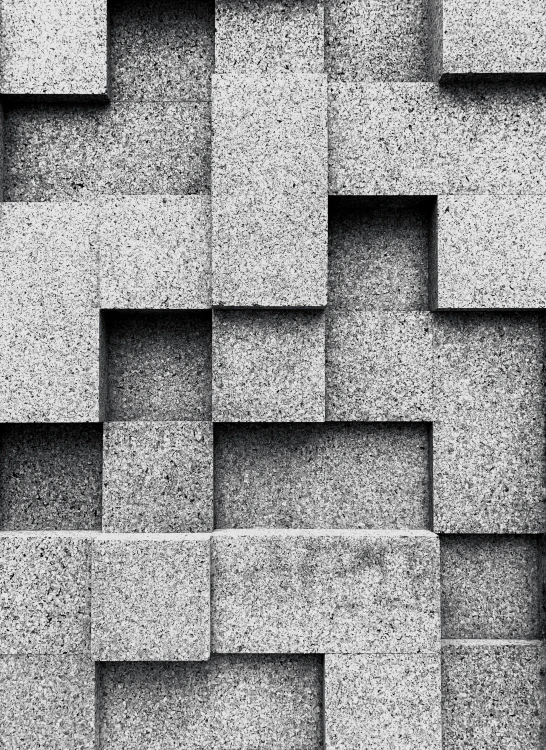 a black and white photo of a brick wall, inspired by Kubisi art, brutalism, square shapes, granite, digital art - w 640, cubes