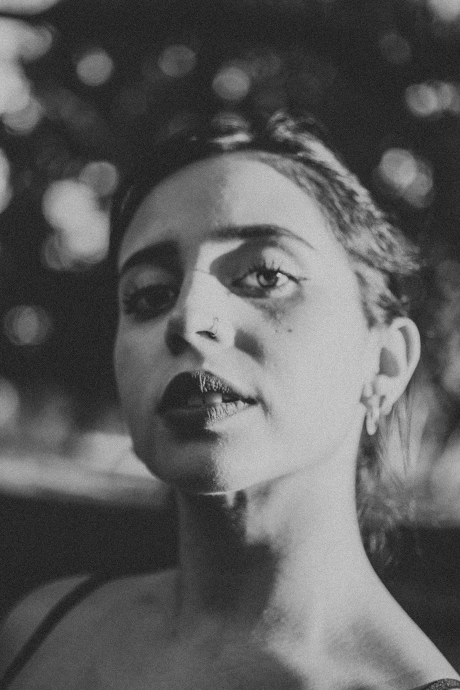 a black and white photo of a woman, inspired by Dora Maar, in style of petra collins, dayanita singh, longer eyebrows, music video