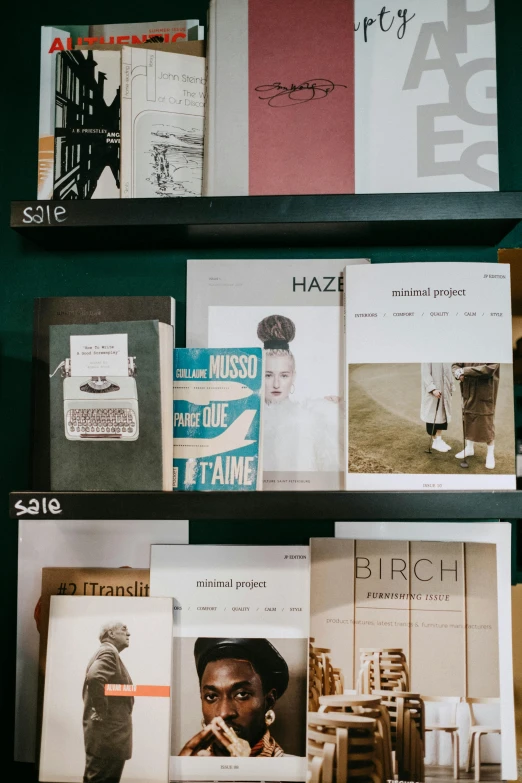 a bunch of books that are on a shelf, by Sigrid Hjertén, private press, cover of a magazine, storefront, teal paper, ecommerce photograph