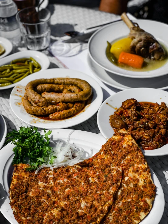 a number of plates of food on a table, a photo, by Kristian Zahrtmann, dau-al-set, meaty, baris yesilbas, thumbnail, overview