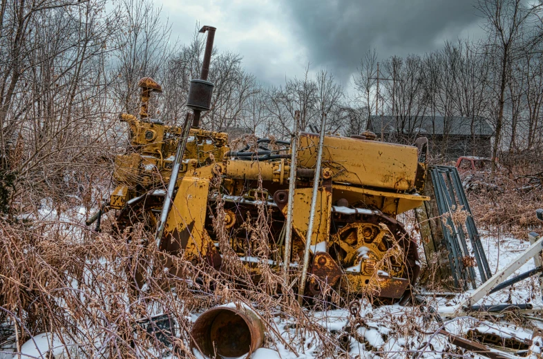 a bulldozer sitting in the middle of a field covered in snow, a portrait, unsplash, auto-destructive art, industrial rusty pipes, yellow, 2 0 0 0's photo, hdr photograph