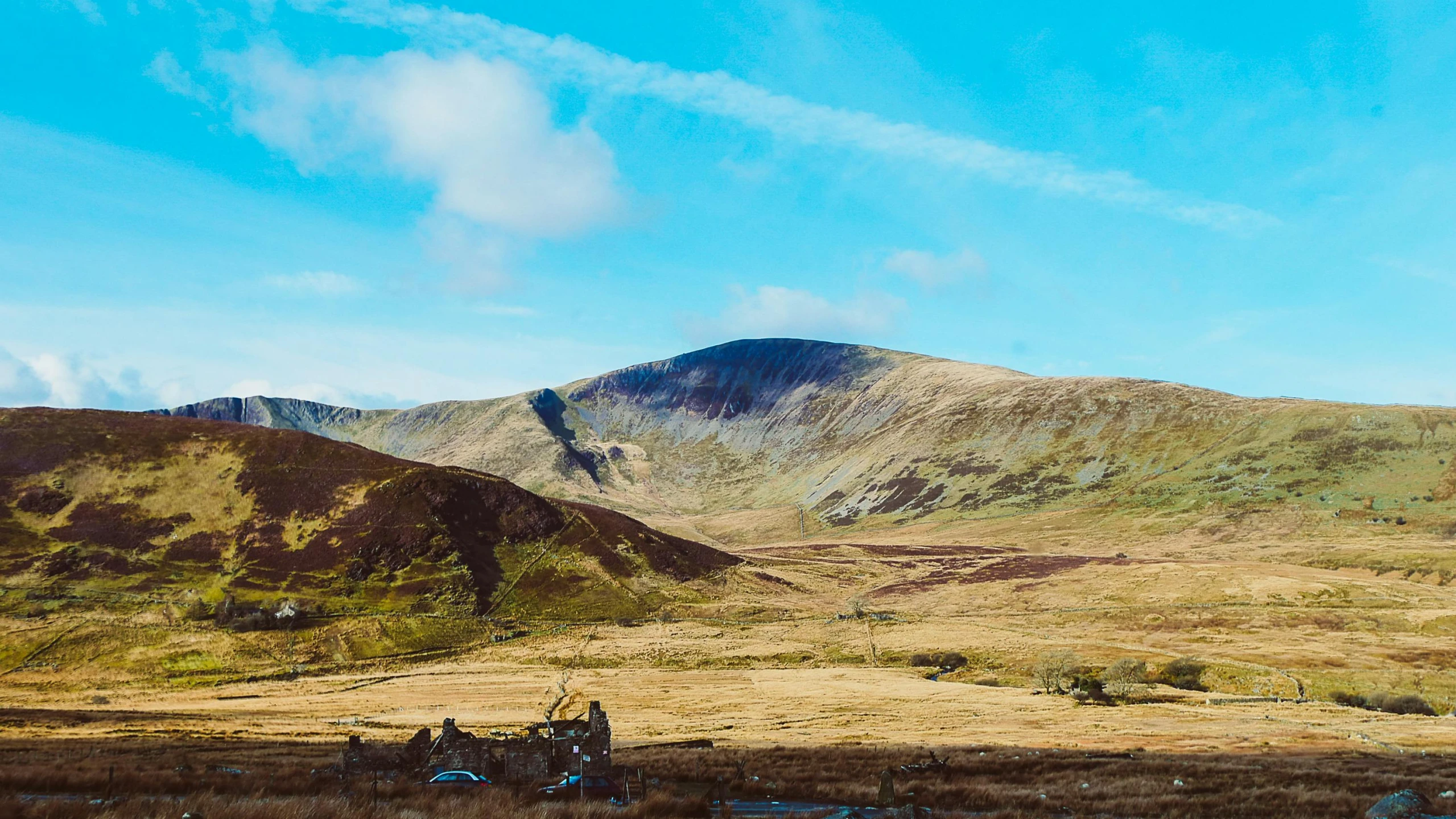 a group of horses that are standing in the grass, by Julia Pishtar, pexels contest winner, land art, irish mountains background, panoramic, blue sky, thumbnail