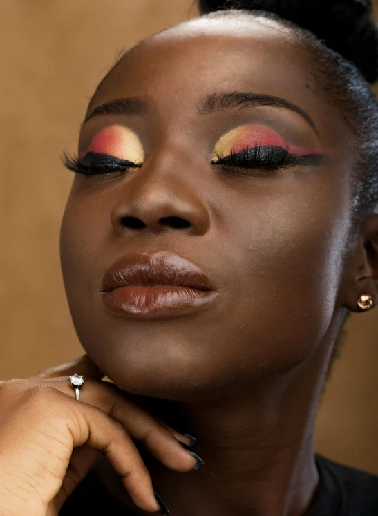 a close up of a person with makeup on, an album cover, inspired by Theo Constanté, trending on pexels, brown red and gold ”, shot with sony alpha 1 camera, avatar image, flawless beauty