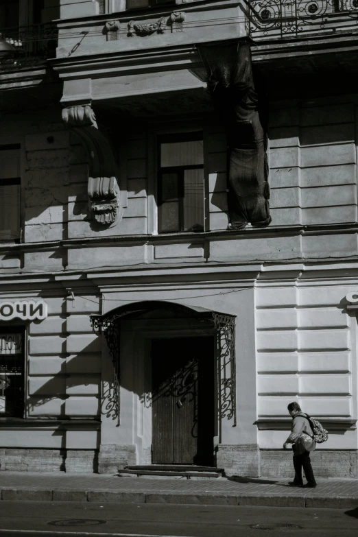 a black and white photo of a building, socialist realism, lviv, low sun, exiting store, high quality image