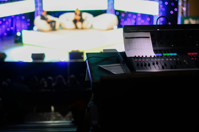 a laptop computer sitting on top of a desk, an album cover, by Robbie Trevino, unsplash, happening, footage of a theater stage, wwe, monitors, tournament