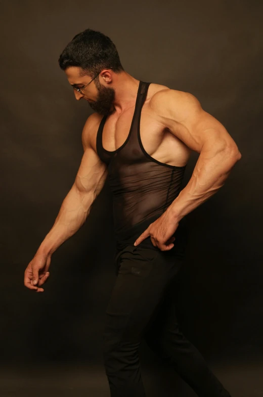 a man in a black shirt and black pants, by Saul Yaffie, reddit, translucent body, wearing : tanktop, low quality photo, editorial image