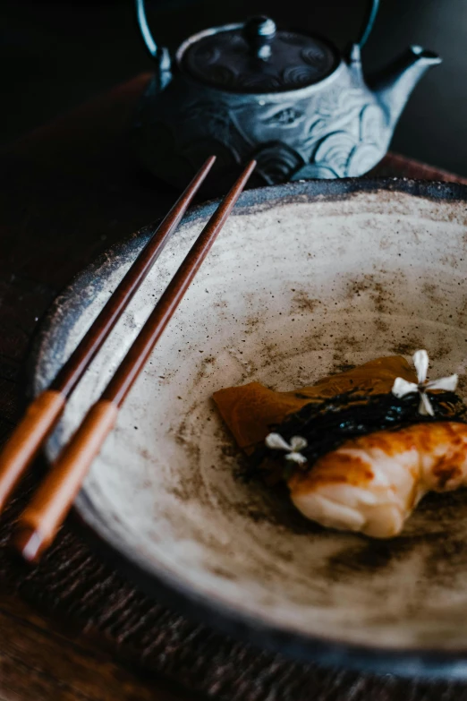 a plate of food with chopsticks and a teapot, a still life, unsplash, mingei, plume made of seaweed, battered, melbourne, banner