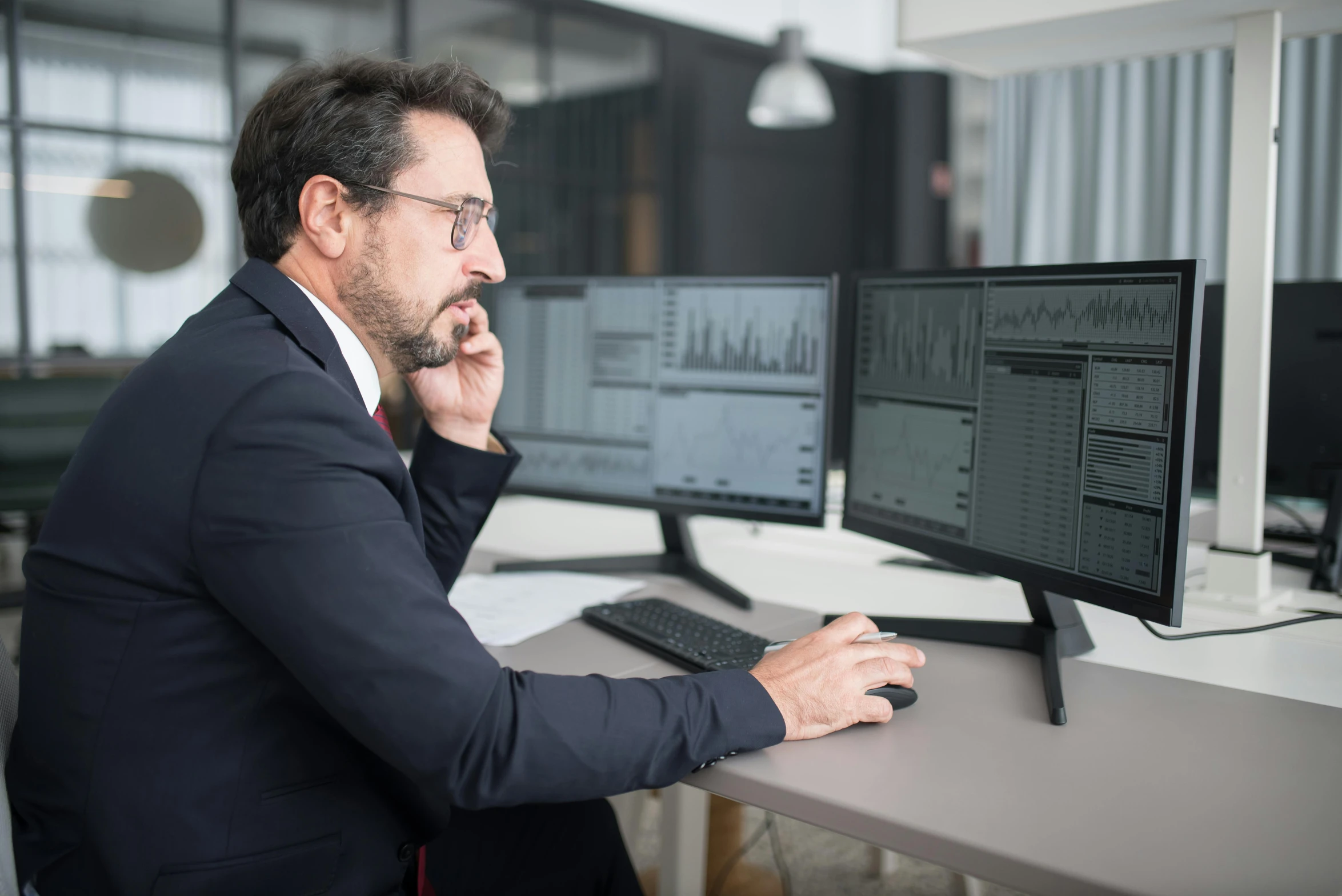 a man sitting at a desk in front of a computer, trading, profile image, multiple stories, leonardo fioravanti