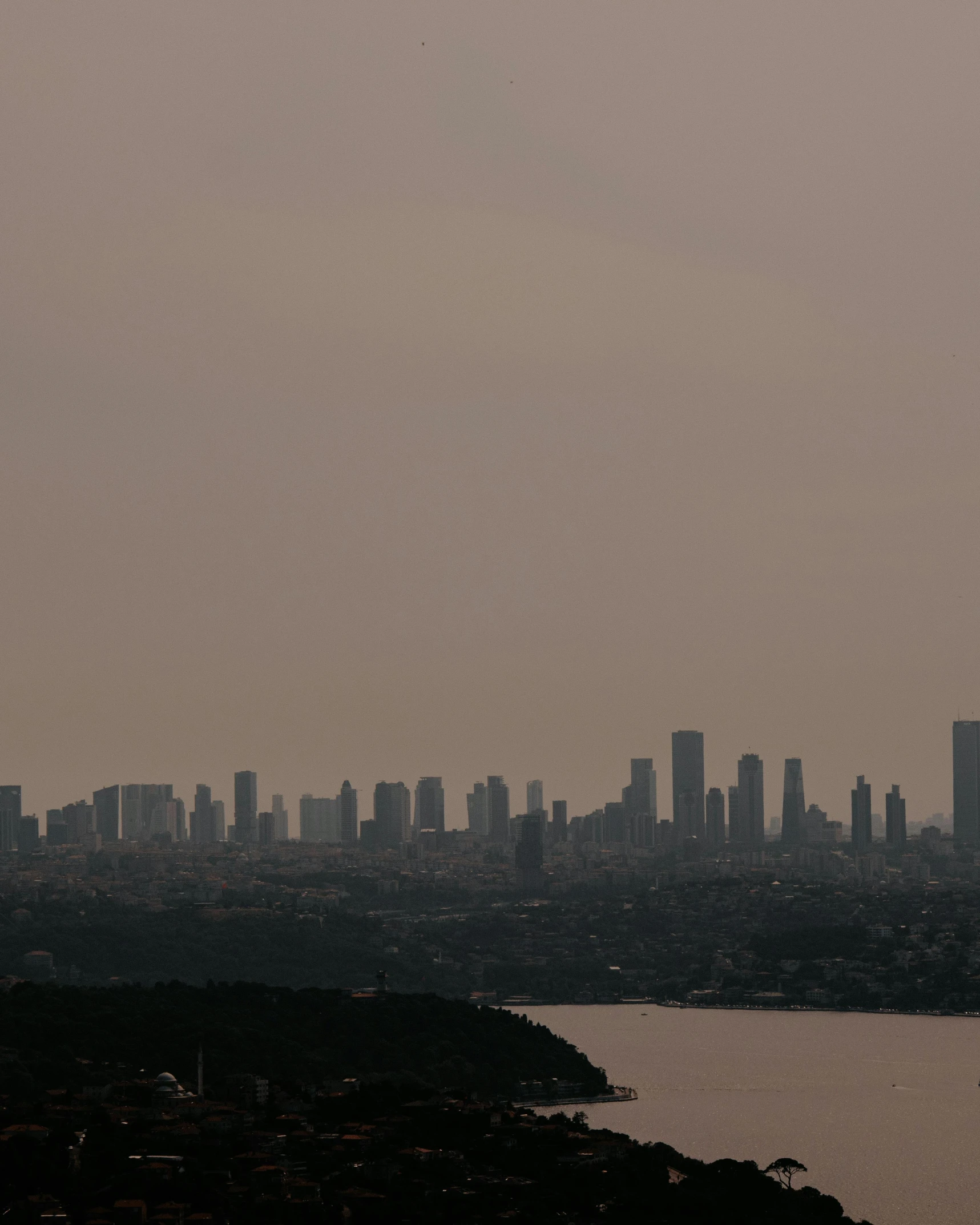 a view of a city from the top of a hill, an album cover, pexels contest winner, hurufiyya, smog, nadav kander, background image, high quality photo