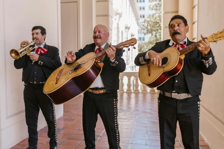 a group of men standing next to each other holding guitars, pexels contest winner, renaissance, mexican mustache, singing at a opera house, square, 3 - piece