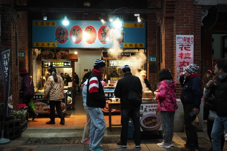 a group of people standing in front of a food stand, pexels contest winner, mingei, warm atmosphere, square, thumbnail, jin shan