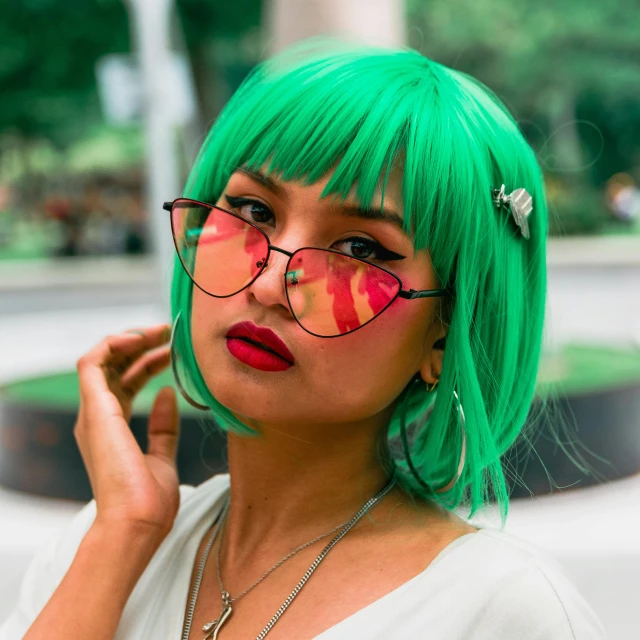 a woman with green hair wearing glasses and a green wig, inspired by Elsa Bleda, trending on pexels, realism, asian girl, square glasses, green bright red, humans of new york style