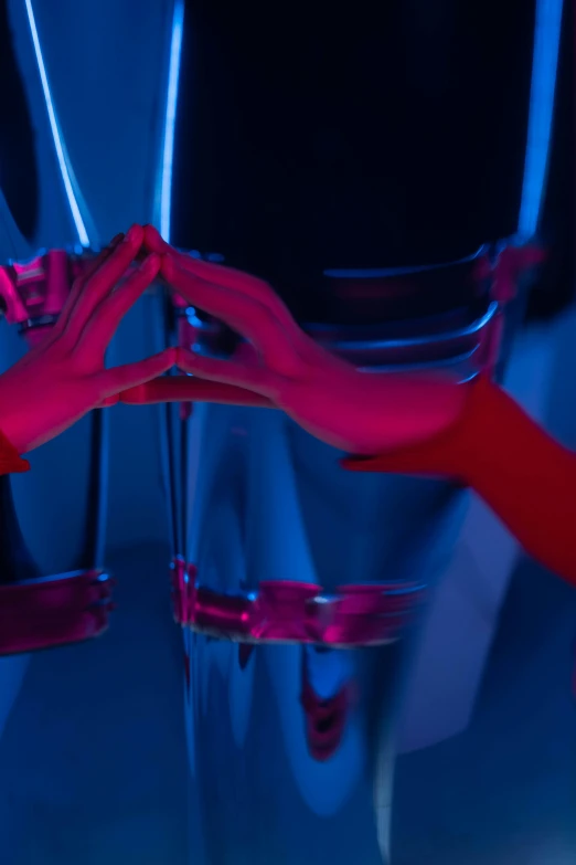 a close up of a person holding a pair of scissors, a hologram, inspired by Yves Klein, red lighting, holding each other hands, liquid glass, cinematic blue lighting