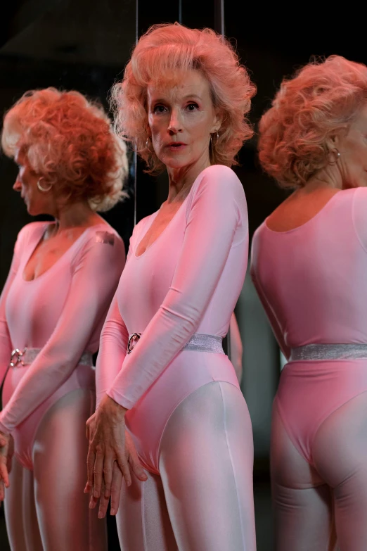 a group of women standing in front of a mirror, inspired by Jean Cunningham, trending on reddit, arabesque, older woman, fullbodysuit, ( ( theatrical ) ), close up details