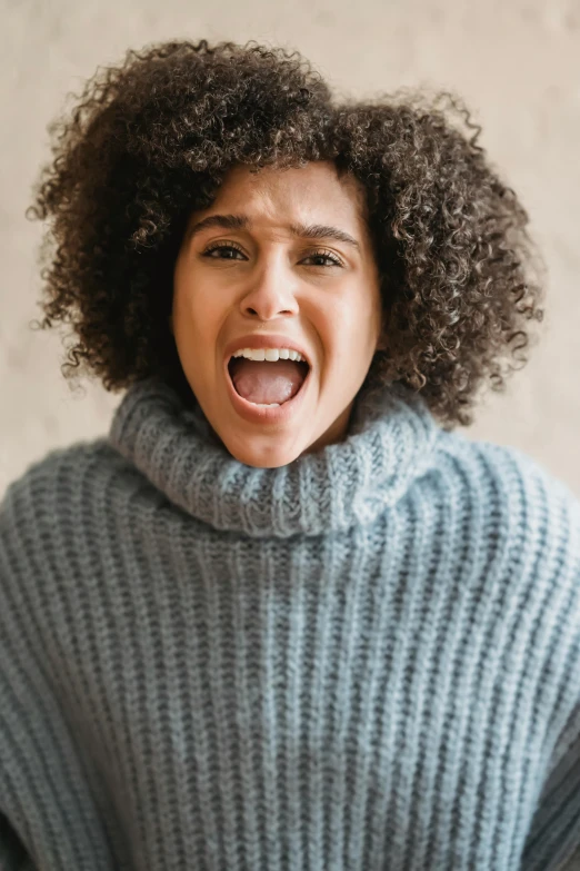 a woman with a surprised look on her face, trending on pexels, grey sweater, man screaming, ashteroth, blue turtleneck