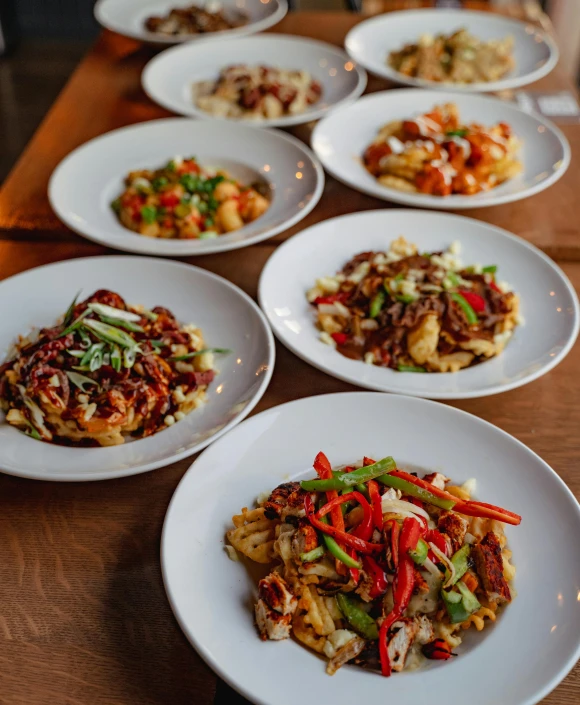 a number of plates of food on a table, pexels contest winner, small chin, hybrids, san francisco, wok