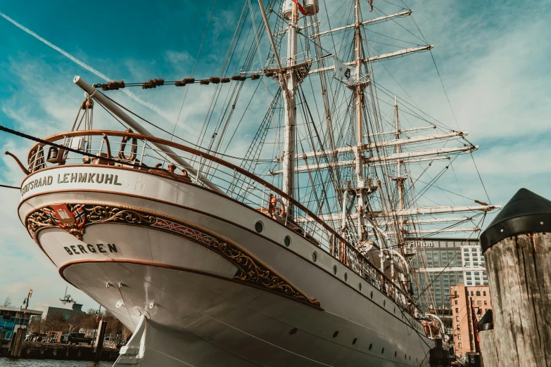 a large white boat sitting on top of a body of water, inspired by Carl Eugen Keel, pexels contest winner, victorian fire ship, brown, hannover, thumbnail