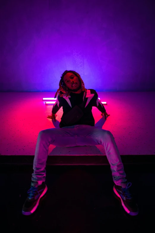 a woman sitting on top of a bed under a purple light, lil wayne, red and blue neon, man sitting facing away, doing a majestic pose