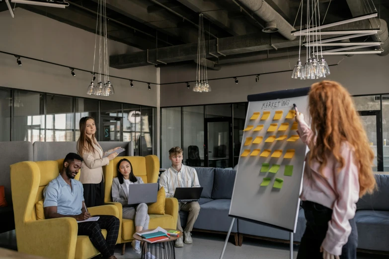 a woman giving a presentation to a group of people, pexels contest winner, backrooms office space, avatar image, cinematic image