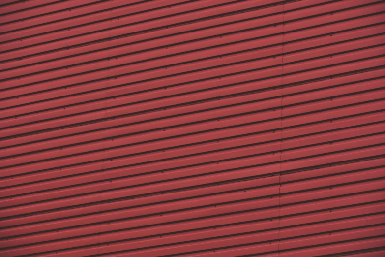 a fire hydrant in front of a red building, inspired by Andreas Gursky, pexels, op art, seamless micro detail, metal cladding wall, red - black, galvalume metal roofing