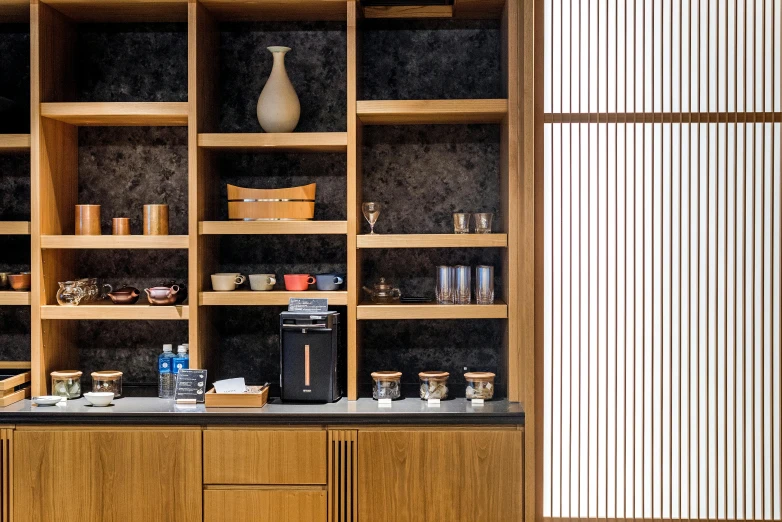 a coffee machine sitting on top of a wooden counter, inspired by Kanō Hōgai, private press, large jars on shelves, thumbnail, high-end onsen, subtle details