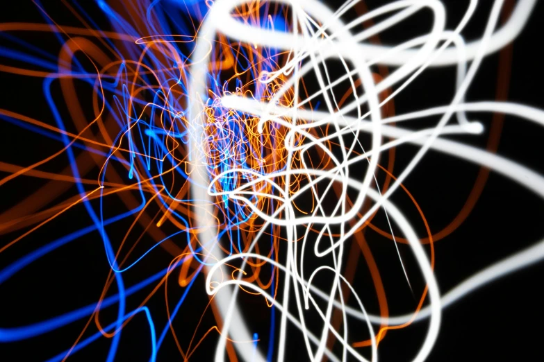 a close up of a blurry picture of a cell phone, by Thomas Häfner, digital art, light trails, orange and blue, scribbles, ((raytracing))