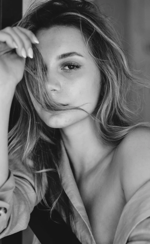 a black and white photo of a woman with long hair, by Emma Andijewska, pexels contest winner, photorealism, casual pose, close up of a blonde woman, portrait sophie mudd, sexy :8