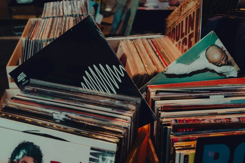a pile of records sitting on top of a table, trending on pexels, shelves filled with tomes, music theme, thumbnail, 1 2 9 7