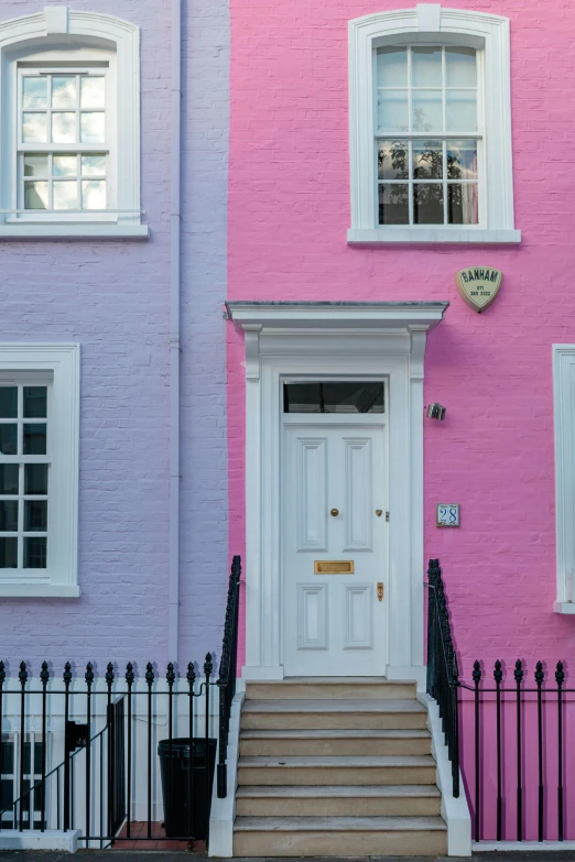 a couple of buildings that are next to each other, by Rachel Reckitt, pexels contest winner, pop art, pink door, white and purple, homes and gardens, pink and gold color scheme