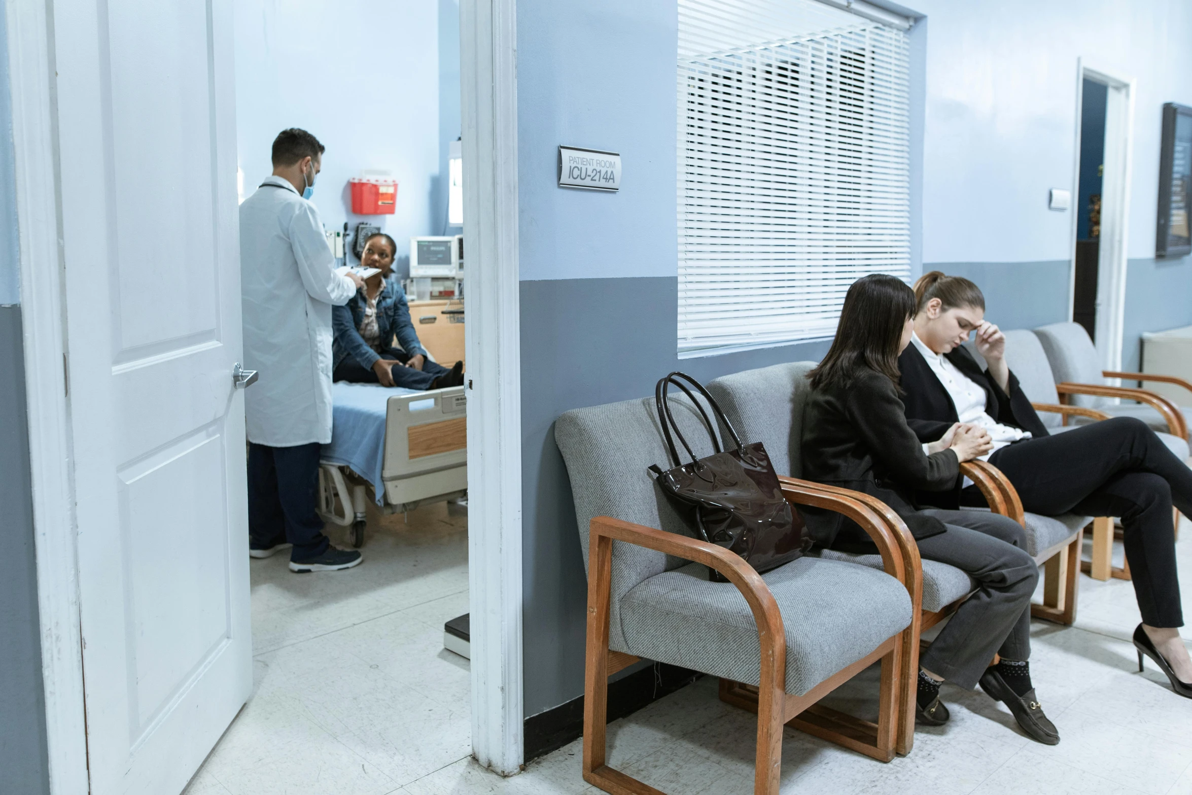 a couple of people that are sitting in a room, by Alejandro Obregón, hurufiyya, doctors office, profile image, multiple stories, a wide shot