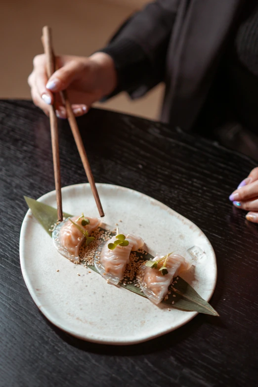 a close up of a plate of food with chopsticks, two hands reaching for a fish, dessert, ninja scrolls, artisanal art