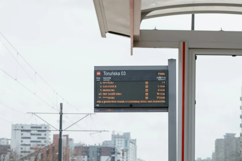 a bus stop with a sign on the side of it, by Attila Meszlenyi, orange line, technological screens, i és complex, 🚿🗝📝