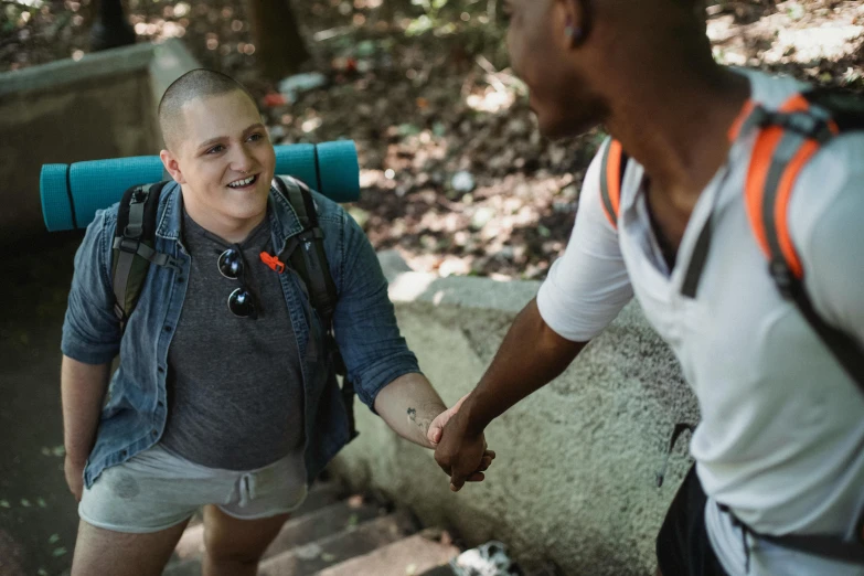 a man and a woman shaking hands in the woods, andy milonakis, shot onfilm, diverse, thumbnail