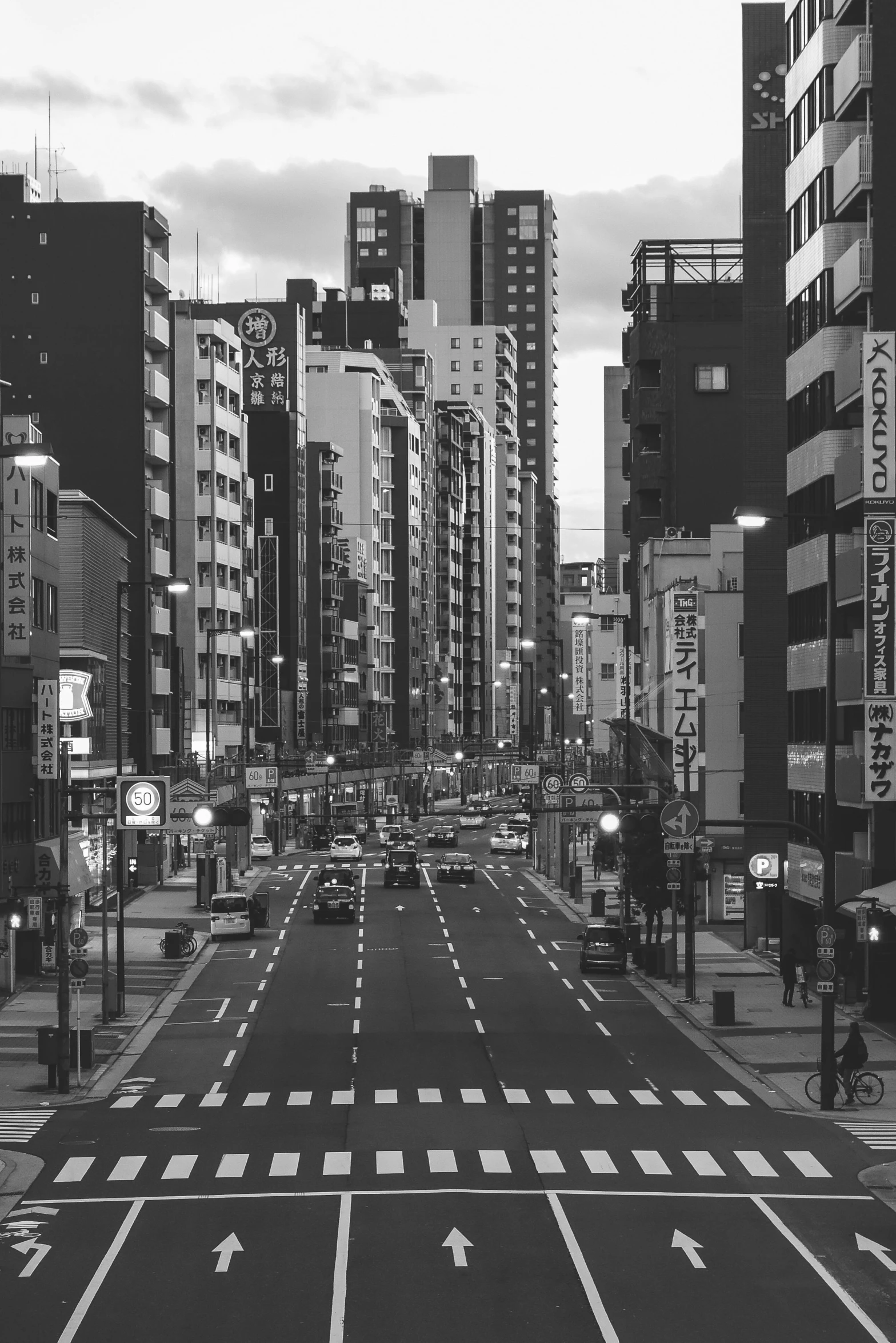 a black and white photo of a city street, inspired by Shinoda Toko, unsplash contest winner, hyperdetailed!!, japanese city pop color palette, no people, high rises