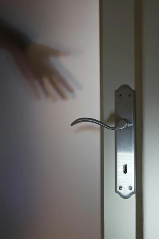 a close up of a door handle on a door, by Adam Chmielowski, conceptual art, hands reaching for her, ghost room, police calling for back up, photograph credit: ap