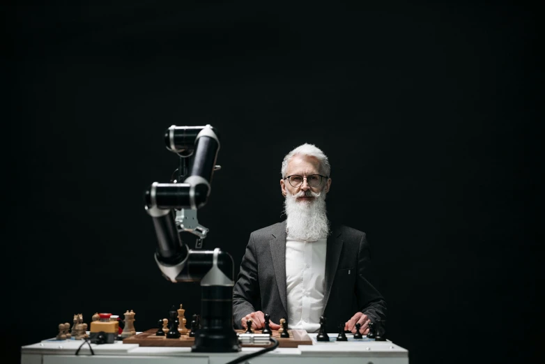 a man with a long white beard playing chess, a portrait, unsplash, with robotic arms, avatar image, fully dressed, photographed for reuters