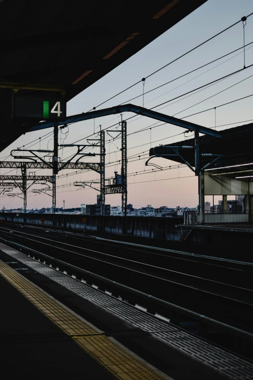 a train pulling into a train station next to a platform, a picture, unsplash, watching the sun set. anime, square, large scale photo, canvas