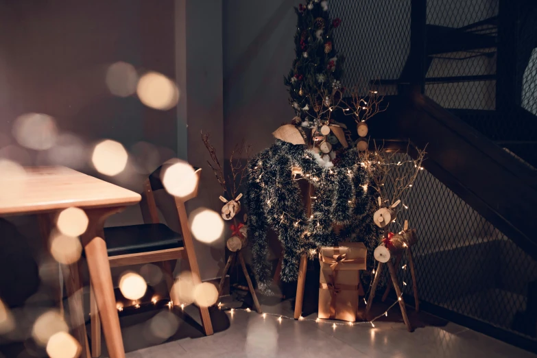 a small christmas tree in the corner of a room, by Julia Pishtar, pexels contest winner, light and space, cafe lighting, forest themed, dark and beige atmosphere, gif
