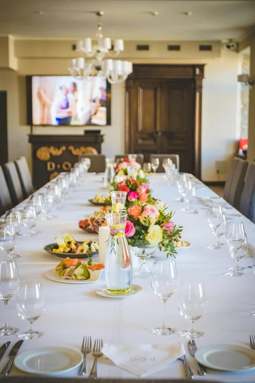 a table that has a bunch of plates on it, by Lynn Pauley, unsplash, renaissance, luxurious wedding, large screen, wine, ready for a meeting