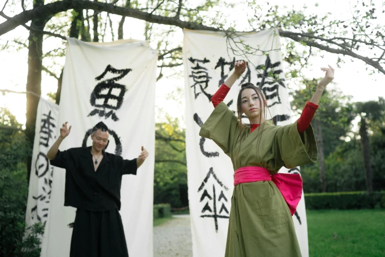 a couple of people that are standing in the grass, a picture, inspired by Kanō Shōsenin, unsplash, sōsaku hanga, performance art, wearing robes, ( ( theatrical ) ), ryohji hase