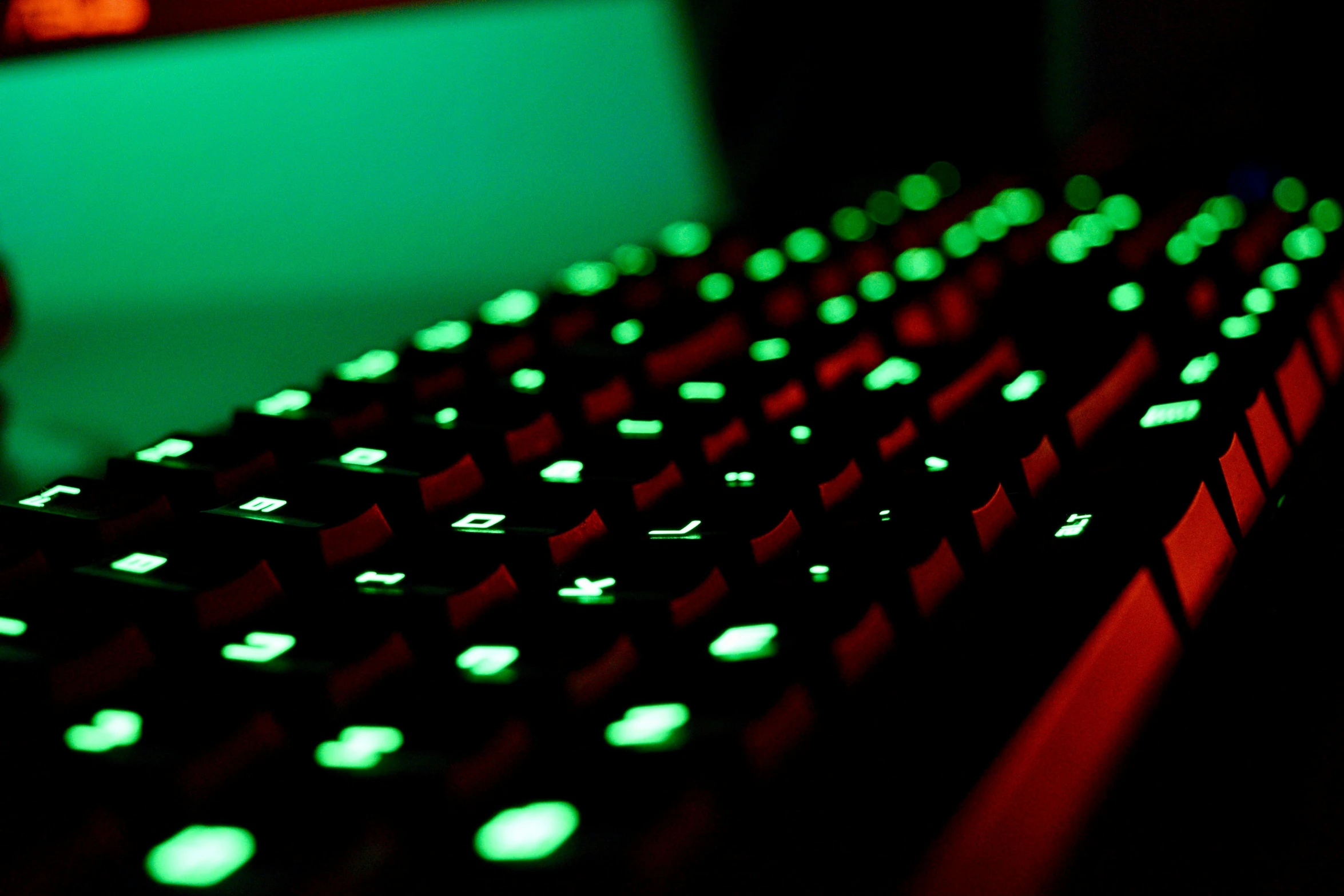 a close up of a keyboard in a dark room, green bright red, hexglow, cyber embellishment, green radioactive glow