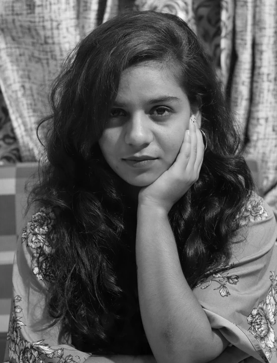 a black and white photo of a woman with long hair, a black and white photo, by Riza Abbasi, a young woman, relaxed expression, taken in the early 2020s, ((portrait))